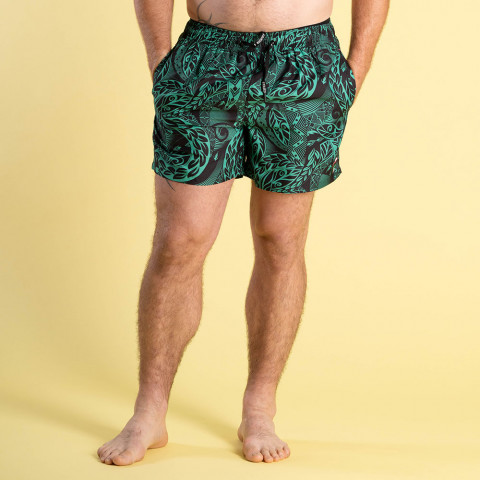 Dark green Maori board shorts