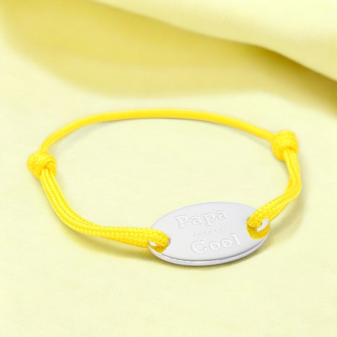Yellow cord bracelet Oval medallion engraved "Papa cool".