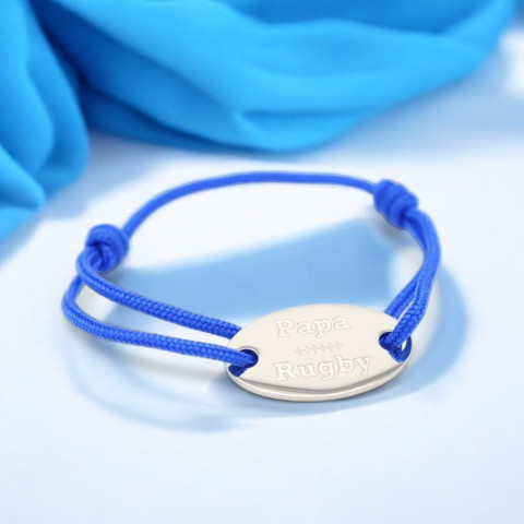 Blue cord bracelet with oval medallion engraved "papa rugby".