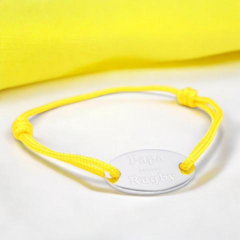 Yellow cord bracelet with oval medallion engraved "papa rugby".