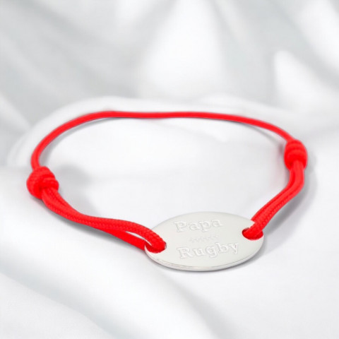 Red cord bracelet with oval medallion engraved "papa rugby".