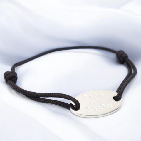 Black cord bracelet with oval medallion engraved "papa rugby".