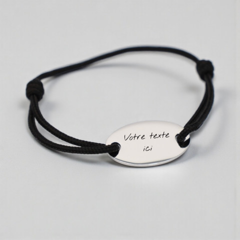 Black bracelet with oval medallion engraving