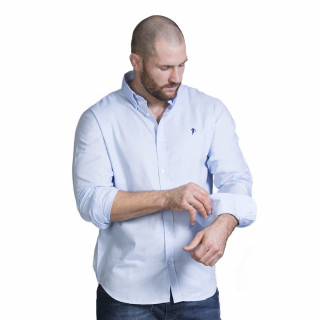 Chemise à manches longues en coton bleu avec logo brodé. Disponible du S au 5XL