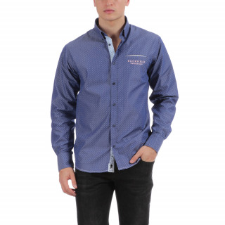 Chemise manches longues en coton bleu avec poche passepoilée et logo brodé.